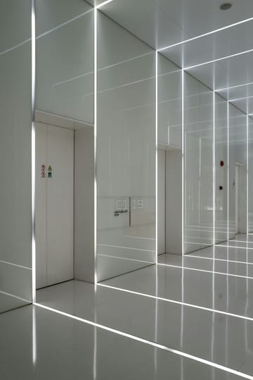 Clean modern corridor with architectural lighting — representing structured, navigable service floors