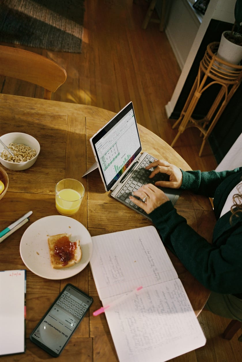 Professional working with spreadsheets and data on a laptop — digital operations and business systems setup