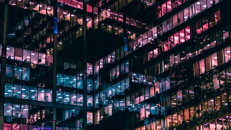 Commercial building at dusk — Qlaio serves commercial property and B2B energy operators