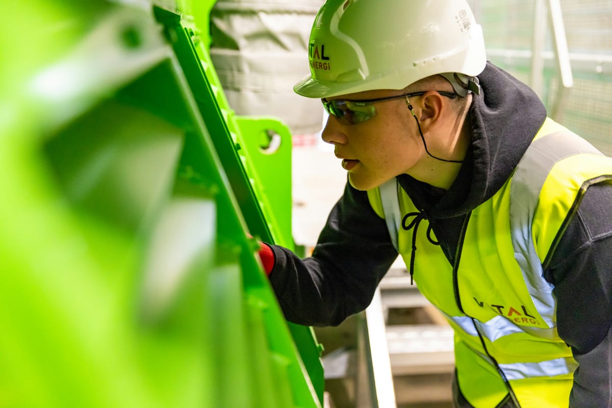 Technician working on building systems — Qlaio supports trades bridging hands-on work and smart technology